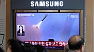 A TV screen shows a file image of a North Korean missile launch during a news program at Seoul Railway Station in Seoul, South Korea, Saturday, Sept. 12, 2026.