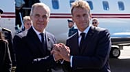 French President Emmanuel Macron, right, greets Canadian Prime Minister Mark Carney as he arrives in Saint-Pierre, Saint-Pierre-et-Miquelon, Sunday, Sept. 20,