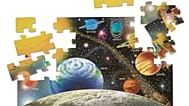 This image released by Melissa & Doug shows a 48-piece solar system floor puzzle. Its large, sturdy pieces make it a fun one for the family to assemble.