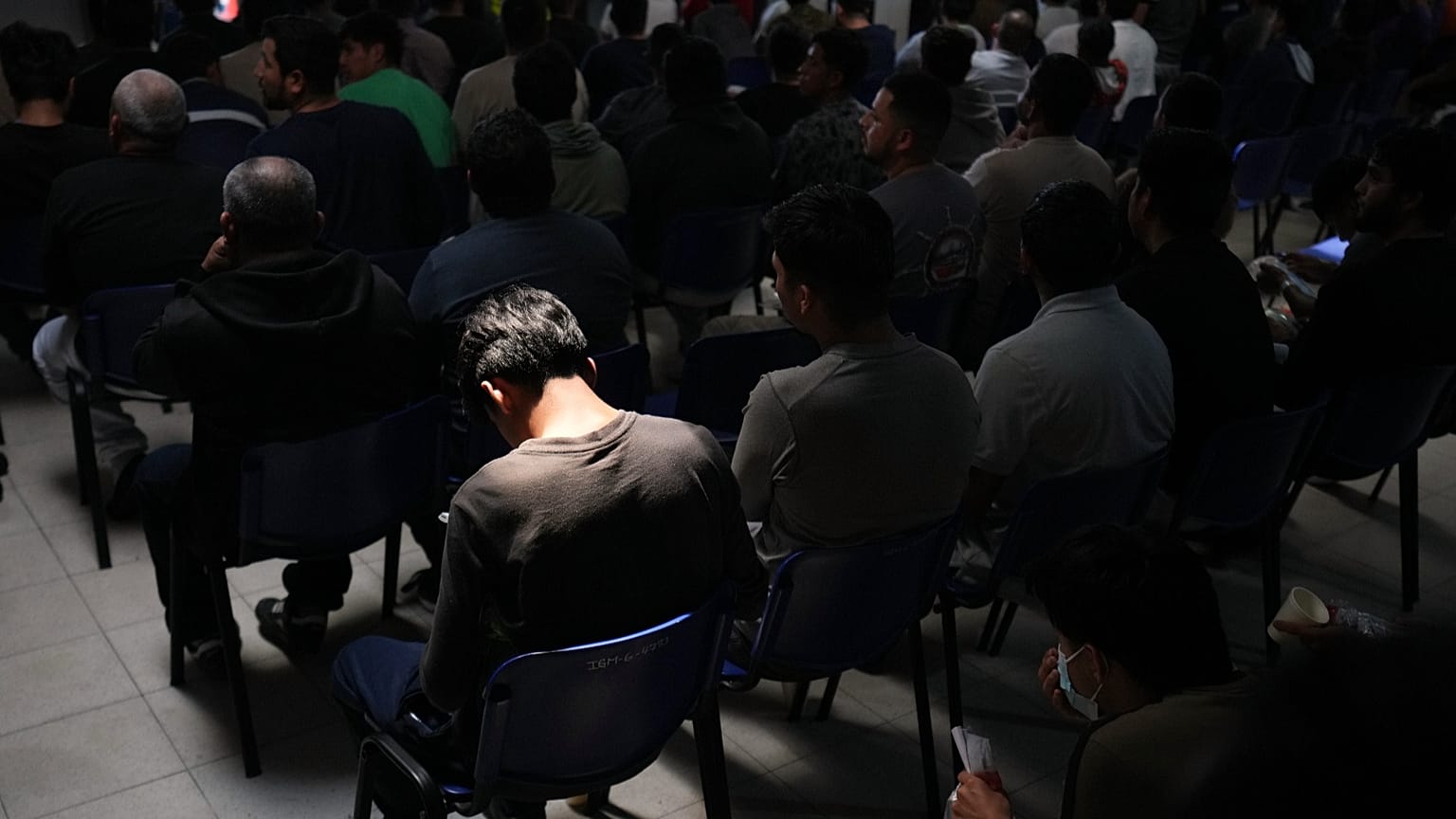 People deported from the US wait inside a processing centre in Guatemala City, 21 August, 2026