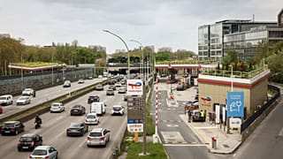 File - Vehicles pass by an Essence gas station of French oil and gas company TotalEnergies along Paris' ring road, Sunday, April 5, 2026. 