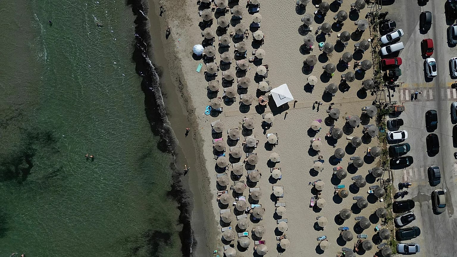 Sun loungers on a beach in Attica