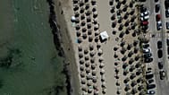 Sun loungers on a beach in Attica