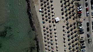 Sun loungers on a beach in Attica