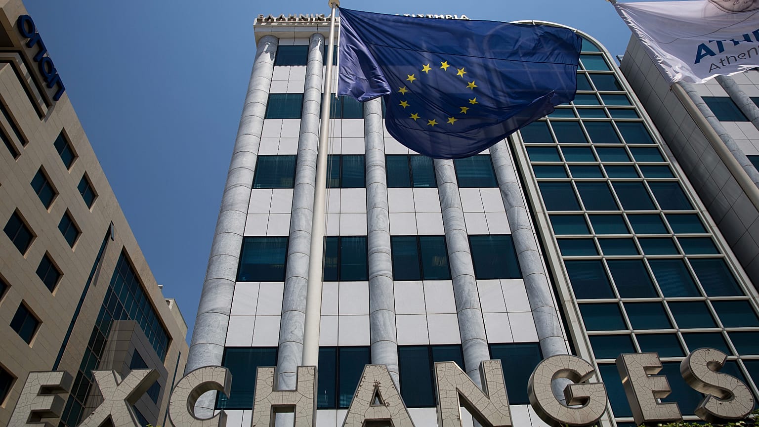 File - A European flag flutters outside the building of the Stock Exchange, in Athens, Friday, 24 June 2016.
