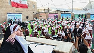 President Pezeshkian symbolically ringing the bell at a girls' primary school in Tehran