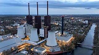Steam leaves a cooling tower of the Lichterfelde gas-fired power plant in Berlin, Germany, on March 30, 2022.