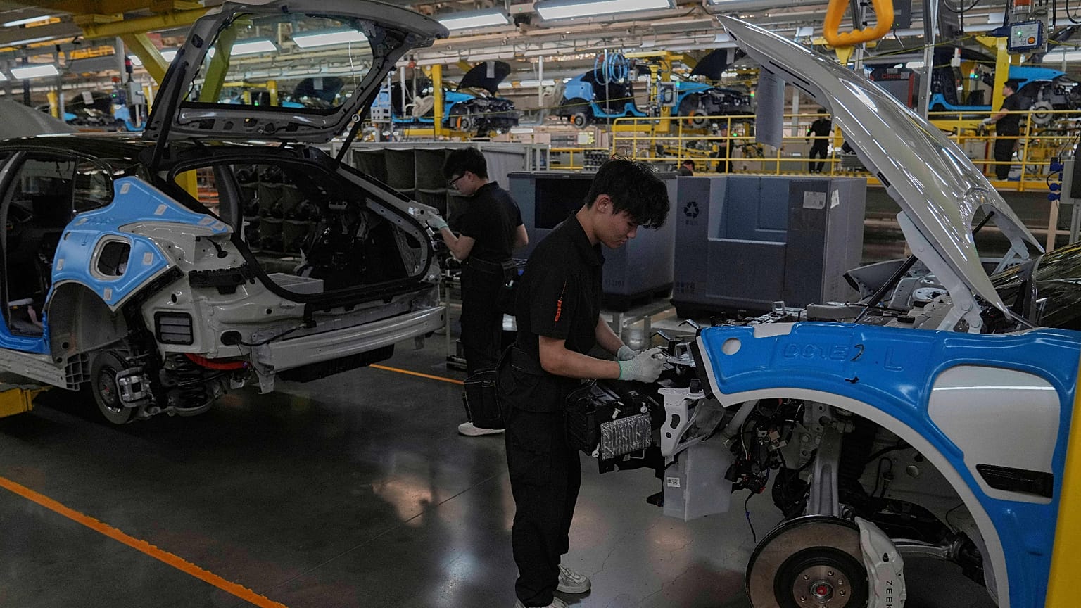FILE. Workers assemble the Zeekr 001 EV models at the Chinese automaker Zeekr assembly plant in Ningbo, east China's Zhejiang Province, 17 April 2025