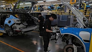 FILE. Workers assemble the Zeekr 001 EV models at the Chinese automaker Zeekr assembly plant in Ningbo, east China's Zhejiang Province, 17 April 2025