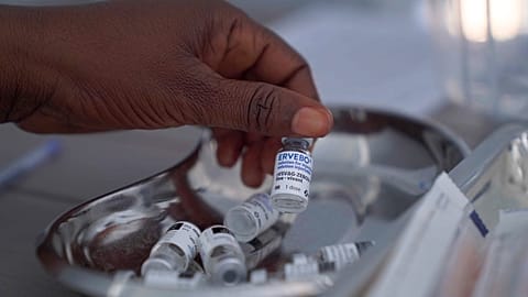 A healthcare worker holds up a vial of the Ervebo vaccine at an Ebola vaccination center in the city of Bunia, Ituri province, Congo, Saturday, Sept. 19, 2026.