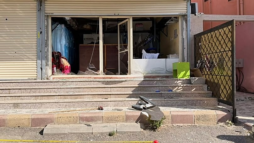 Firefighters inspect damage caused by falling debris from a drone that Saudi authorities say was launched by the Houthis over Taif province, 17 September, 2026