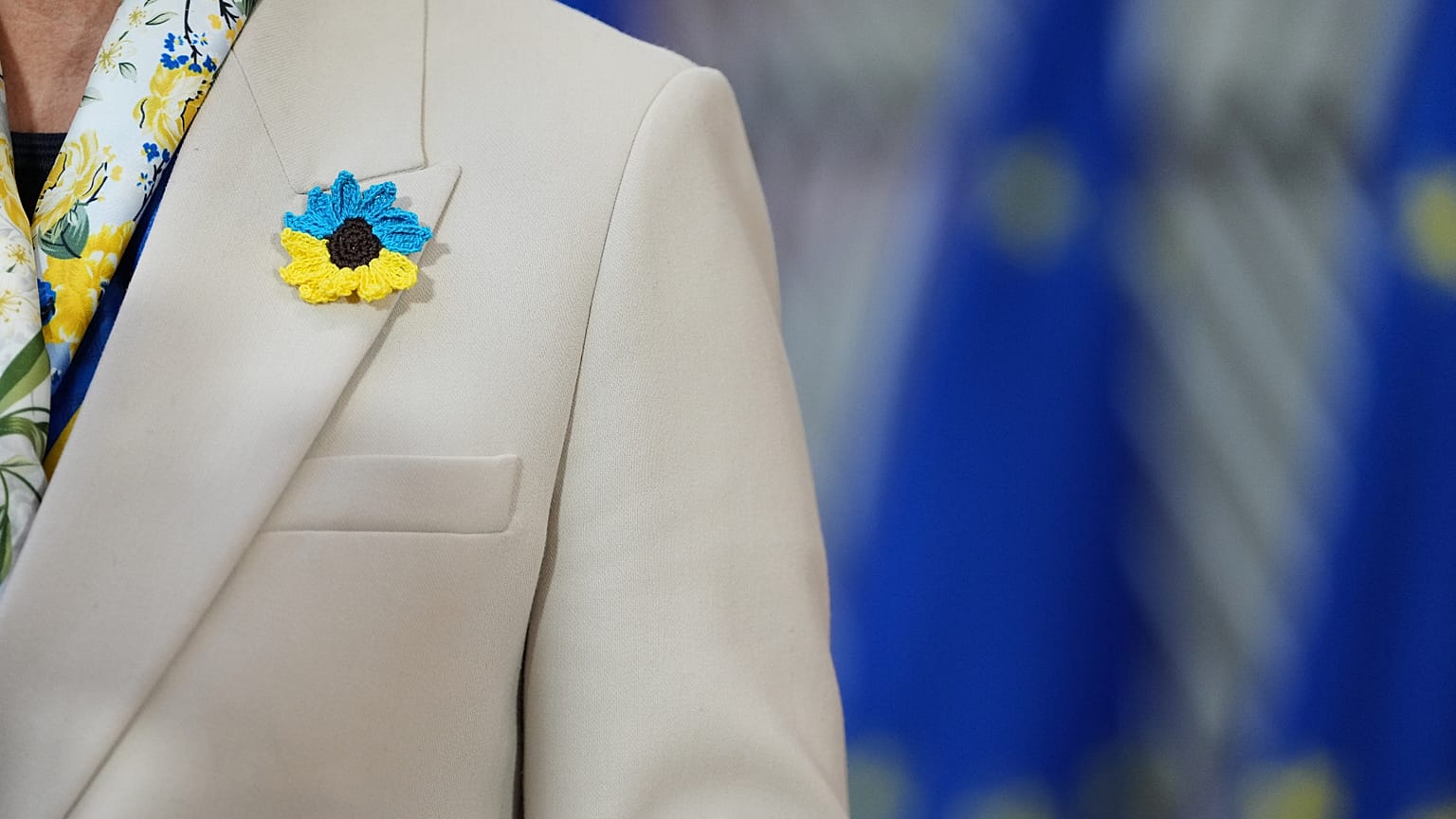 Latvia's Foreign Minister Baiba Braže wears a crochet flower in Ukrainian flag colours in Brussels, Belgium, 23 February 2026.