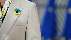 Latvia's Foreign Minister Baiba Braže wears a crochet flower in Ukrainian flag colours in Brussels, Belgium, 23 February 2026.