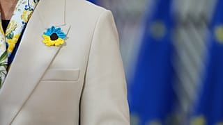 Latvia's Foreign Minister Baiba Braže wears a crochet flower in Ukrainian flag colours in Brussels, Belgium, 23 February 2026.