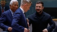 Ukraine's President Volodymyr Zelenskyy, right, greets Hungary's Prime Minister Peter Magyar, center, next to European Council President Antonio Costa during a round table mee
