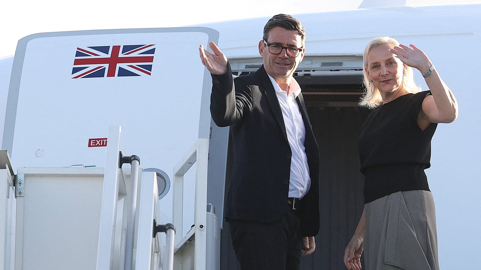 Britain's Prime Minister Andy Burnham and his wife Marie-France van Heel board a plane for the United States, at Stansted Airport, Stansted, England, Monday Sept. 21, 2026,