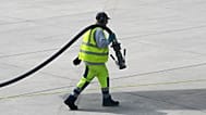 File - A worker prepares to fill up an aircraft with jet fuel at the airport in Duesseldorf, Germany, 27 April 2026.