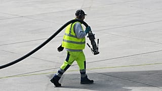 File - A worker prepares to fill up an aircraft with jet fuel at the airport in Duesseldorf, Germany, 27 April 2026.