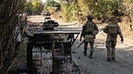  Ukrainian soldiers walk along the street in the frontline town of Druzhkivka, Donetsk region, Ukraine.