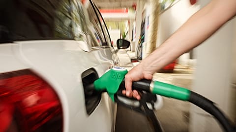 A customer fuels his vehicle at an Essence gas station in Paris, 5 April 2026. 