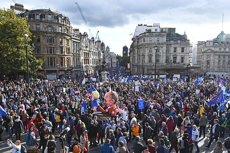 Anti-Brexit supporters during a protest march through Trafalgar Square in London, Saturday, Oct. 19, 2019.
