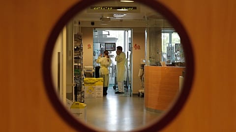 Doctors examine a patient in the intensive care unit of the Queen Fabiola children's hospital in Brussels on Monday, 25 November 2013.