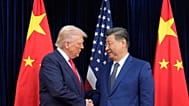 President Donald Trump, left, and Chinese President Xi Jinping, right, shake hands before their meeting at Gimhae International Airport in Busan, South Korea, Oct. 30, 2025.