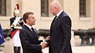 French President Emmanuel Macron, left, greets Latvian Prime Minister Andris Kulbergs ahead of the Coalition of the Willing summit 