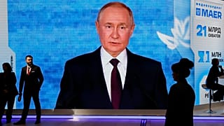 FILE: People walk past a screen with an image of Russian President Vladimir Putin at an exhibition at the St Petersburg International Economic Forum, 4 June 2026