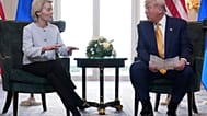 President Donald Trump and European Commission President Ursula von der Leyen talk after reaching a trade deal at the Trump Turnberry golf course in Scotland, July 2025. 