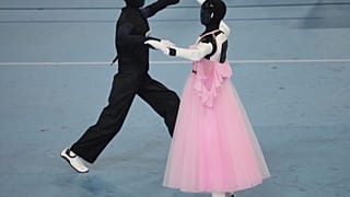 Humanoid robots compete in the dance during the World Humanoid Robot Games in Beijing, Tuesday, Aug. 25, 2026.