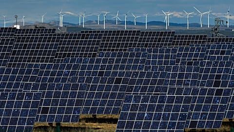 Solar panels work near the small town of Milagro, Navarra Province, northern Spain, on Feb. 24, 2023.