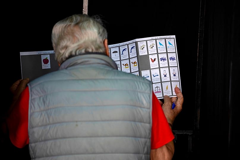 A voter looks over his ballot paper during Morocco's parliamentary election in Rabat.