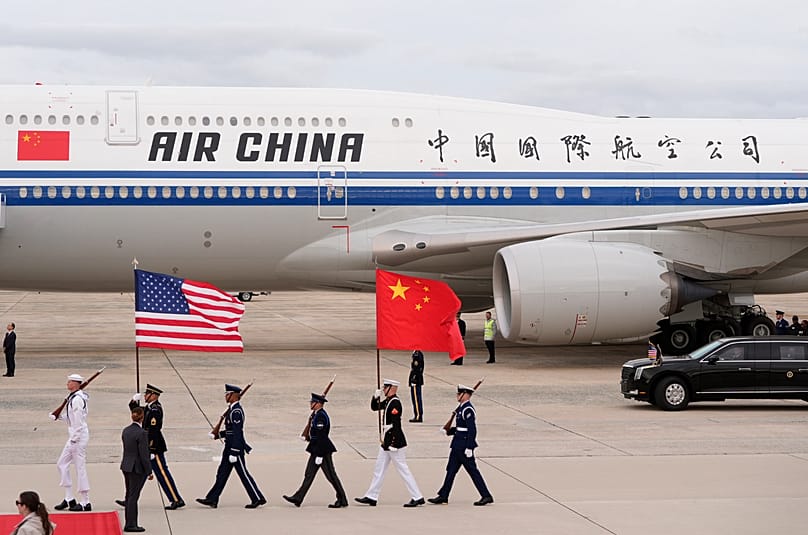 Flags are marched in as an Air China airplane with Chinese President Xi Jinping and his wife Peng Liyuan aboard, arrives at Joint Base Andrews, Md., Wednesday, Sept. 23, 2026.