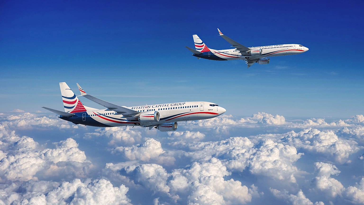 أرشيف - طائرتان من طراز بوينغ 737 ماكس تحملان ألوان شركة "أفييشن كابيتال غروب" خلال الطيران. (صورة: بيزنس واير) / أسوشيتد برس