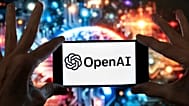 The OpenAI logo is displayed on a mobile phone in Boston, 8 December, 2023