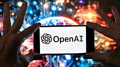 The OpenAI logo is displayed on a mobile phone in Boston, 8 December, 2023