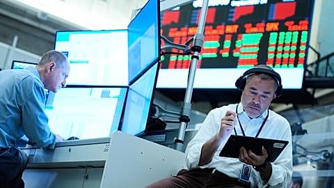 FILE - Justin Kanda works on the floor at the New York Stock Exchange in New York, Monday, Sept. 14, 2026. (AP Photo/Seth Wenig)