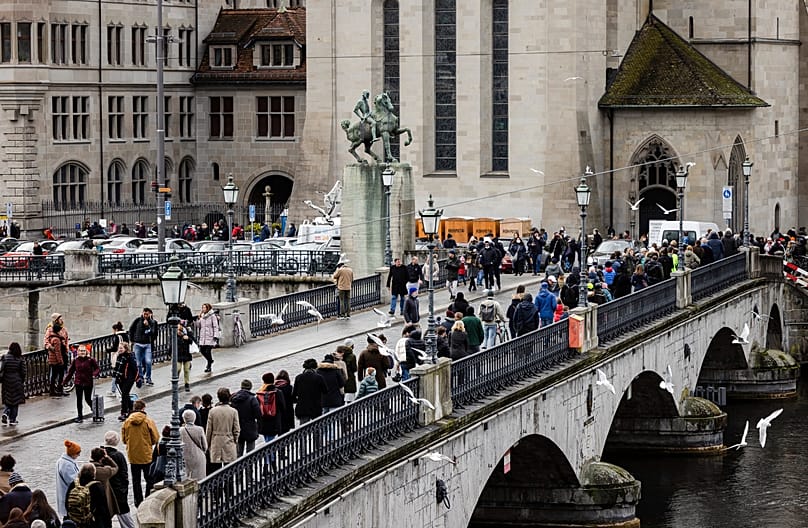 People queue to Zurich City Hall to cast their ballot in a referendum, 28 November, 2021