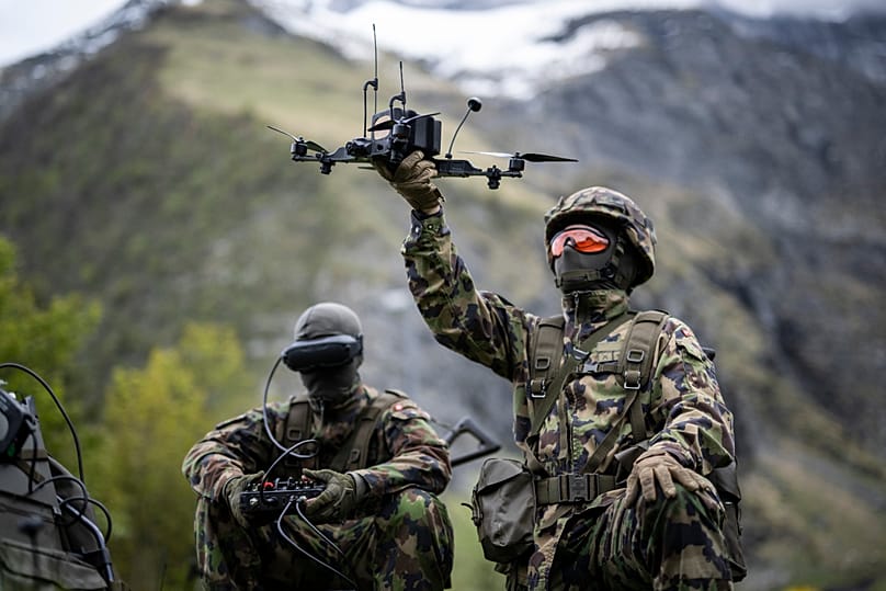 A soldier poses with a drone during a press event of the Swiss Army in Elm, 18 May, 2026