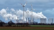 Renewable and fossil-fuel energy is produced when wind generators are seen in front of a coal fired power plant near Jackerath, Germany, Friday, Dec. 7, 2018.