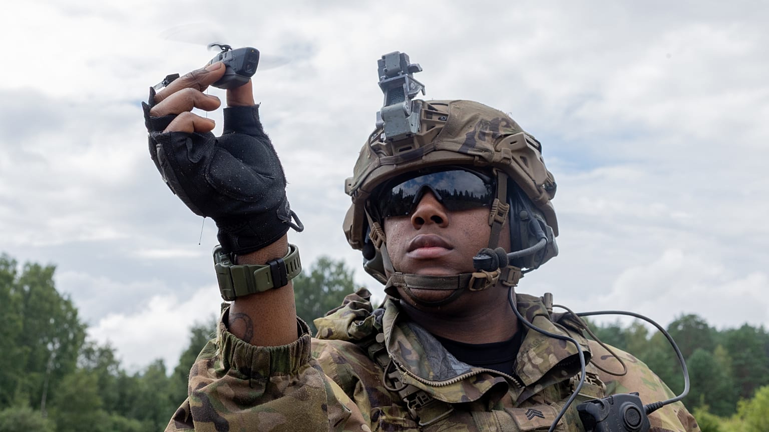 A US Army Soldier prepares to launch his Black Hornet micro drone.