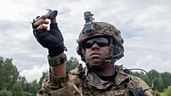 A US Army Soldier prepares to launch his Black Hornet micro drone.