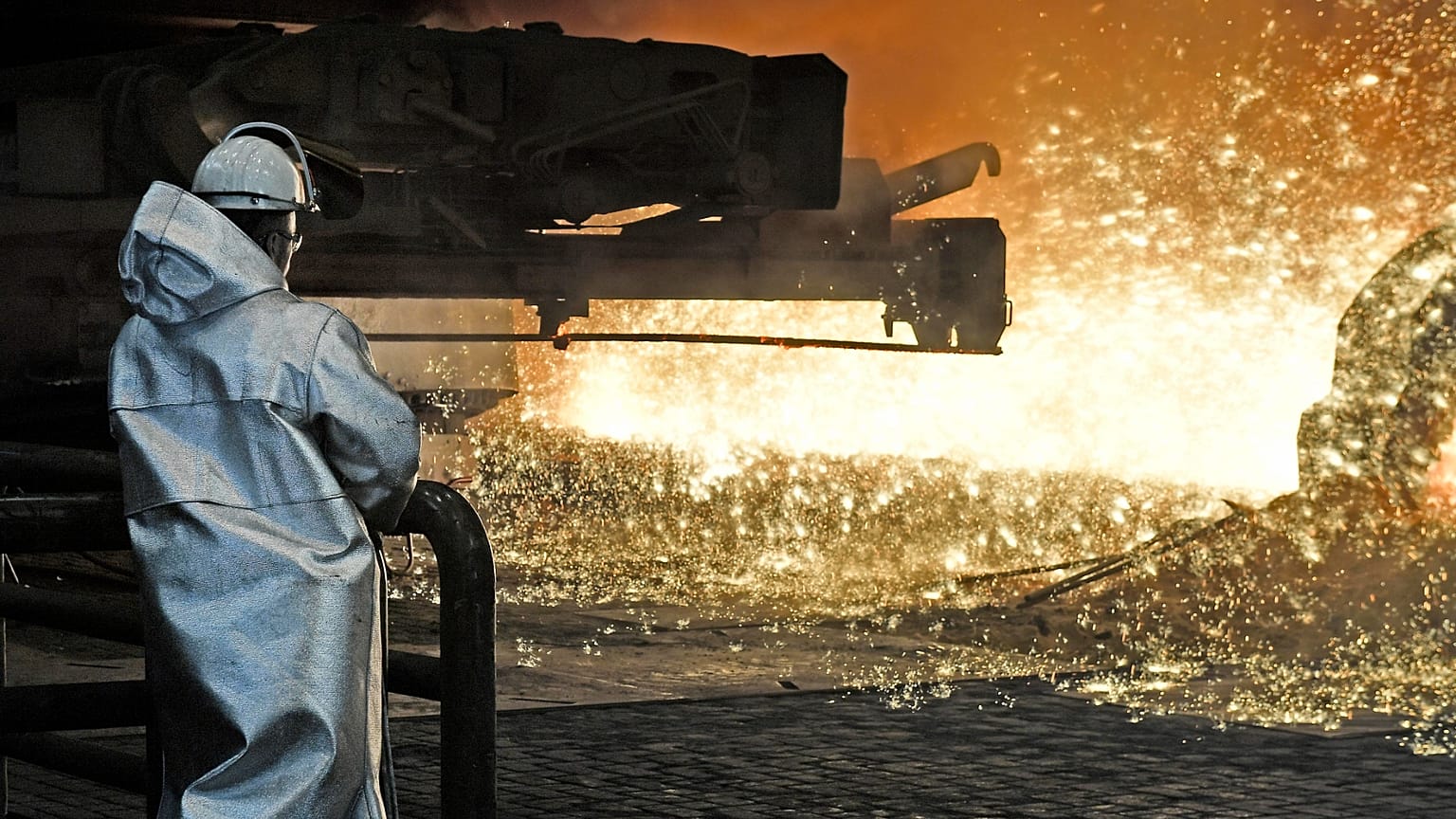 A steel worker watches the hot metal at the Thyssenkrupp steel factory in Duisburg, Germany, 27 April 2018. Duisburg is the biggest steel producer site in Europe.