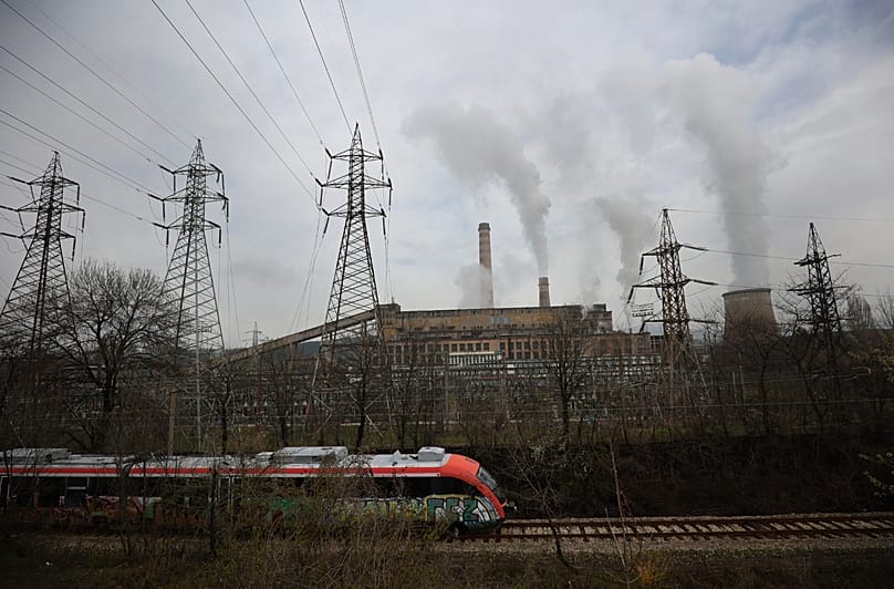 A train passes by Republika Power Plant in town of Pernik, 21 April, 2022