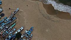 Fishing boats sit on Manzanillo beach for safe keeping after Hurricane Erick hit near Acapulco, Mexico, Thursday, June 19, 2025.