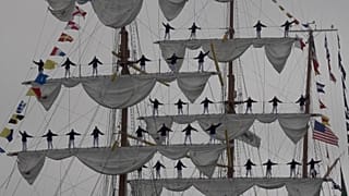 Cuauhtémoc docking along the Embarcadero near the Bay Bridge, San Francisco, USA as sailors stand on masts while singing, Sept. 23, 2026