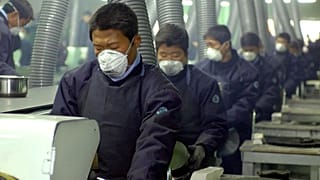 North Korean workers at a factory, illustrative photo