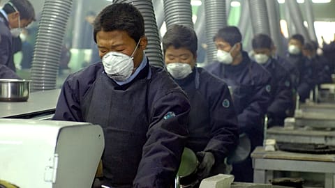 North Korean workers at a factory, illustrative photo