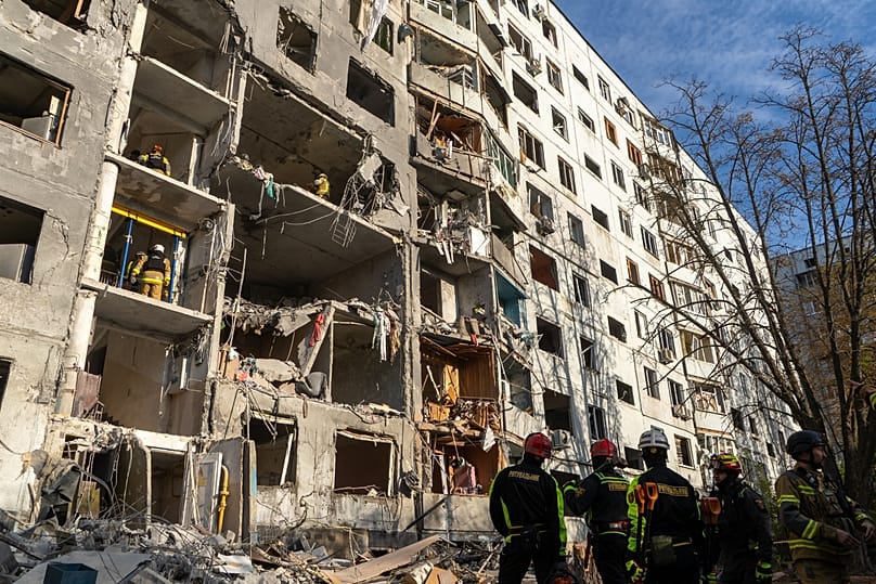 Rescue workers clear the rubble from a residential house damaged in a Russian strike on Kharkiv, 28 September, 2026
